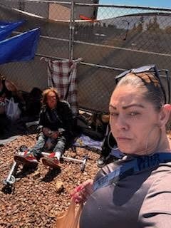 A volunteer taking a selfie during an encampment visit
